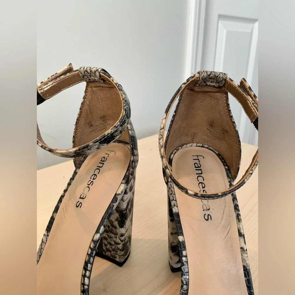 Francesca’s snake print embossed ankle strap heels